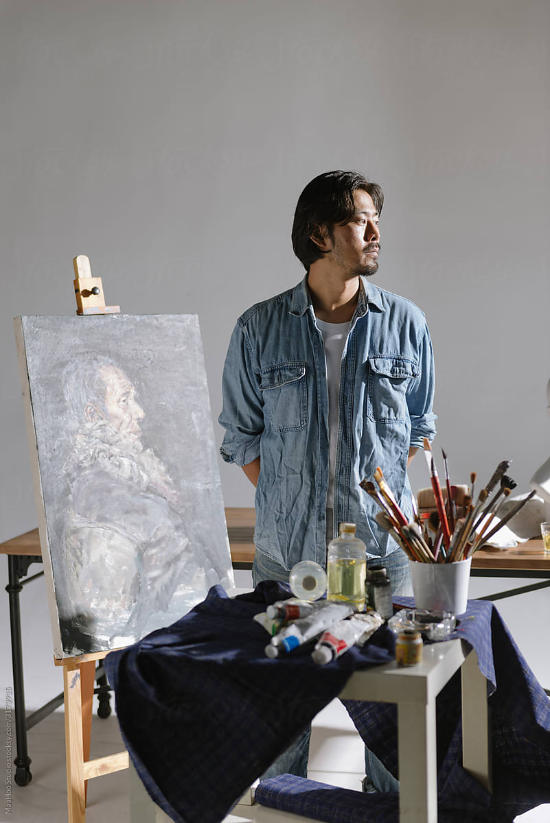 Male artist woking in studio