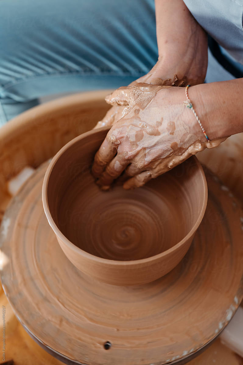 Potter creating vase on wheel