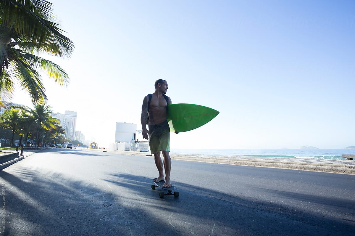 Surfer on skateboard. Ipanema beach. Rio