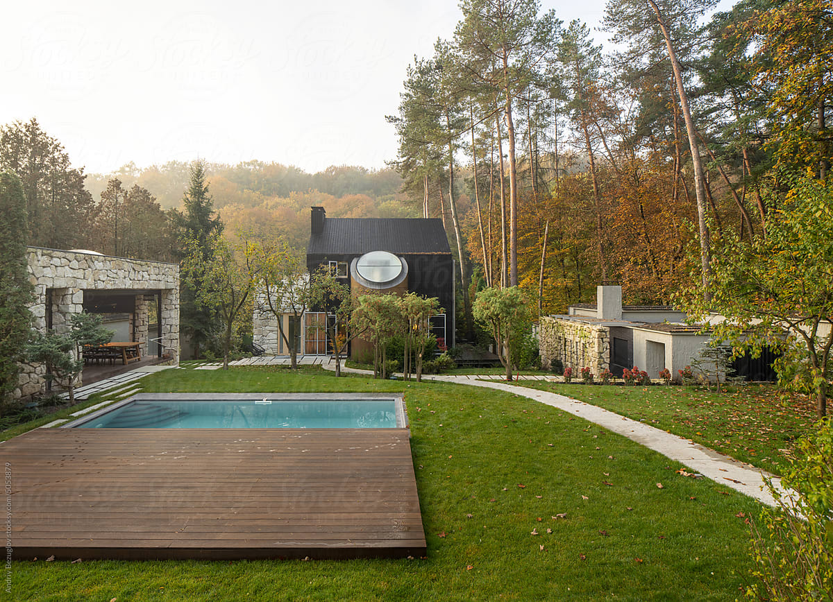 Suburban home from natural materials with outdoor pool