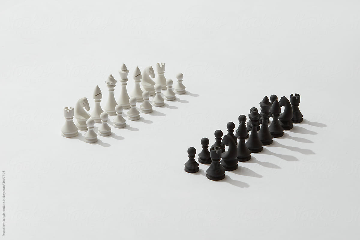 Lined up chess figures before a battle game.