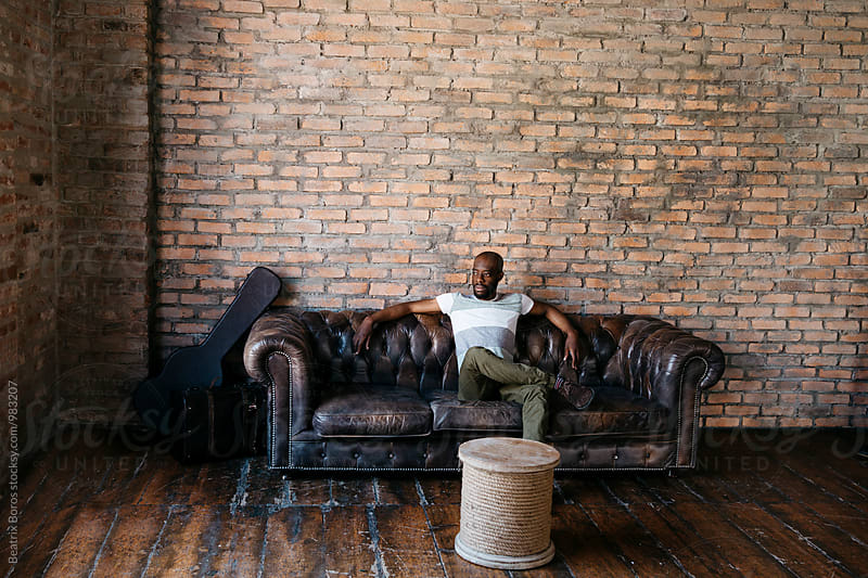 African American man sitting on a couch