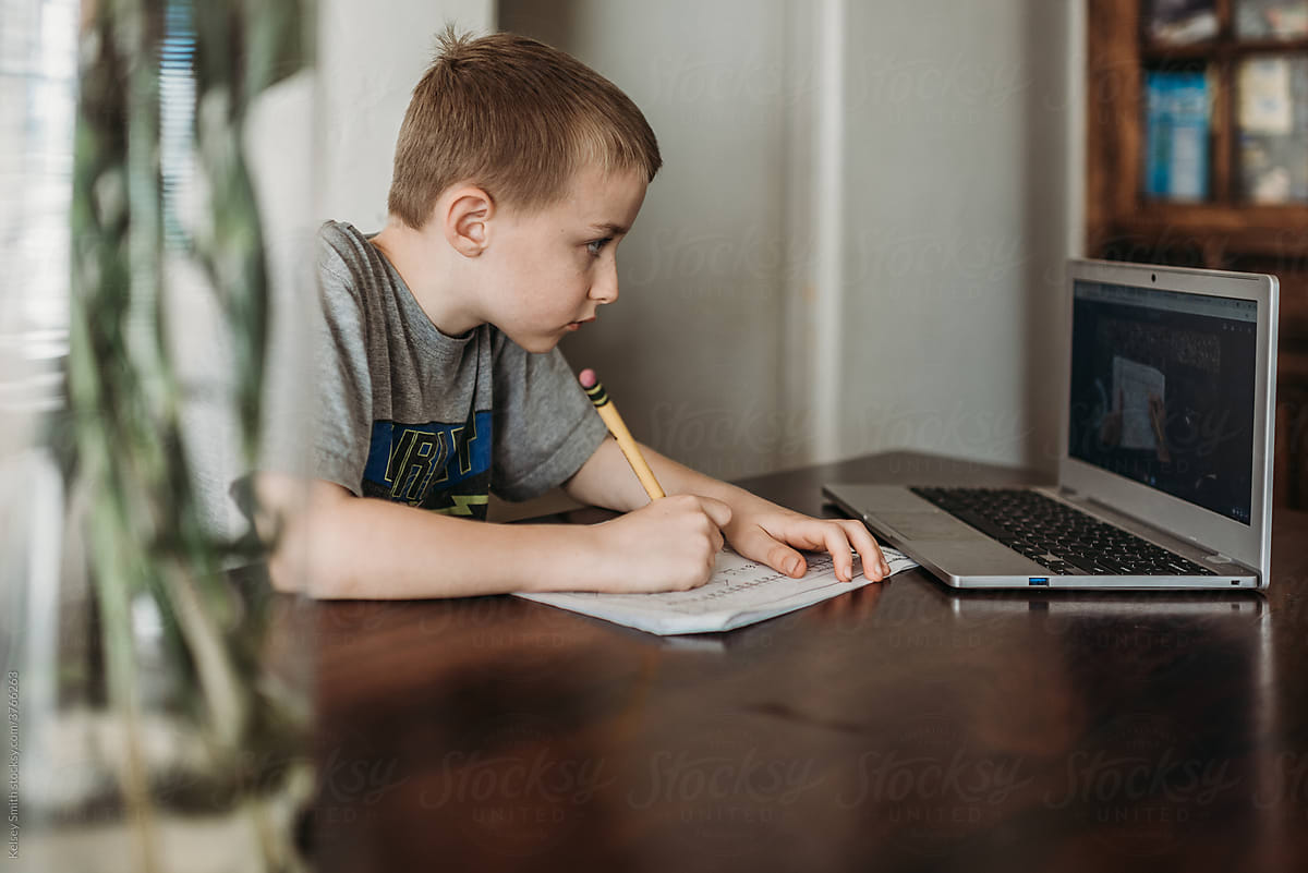 Elementary age child distance learns from home