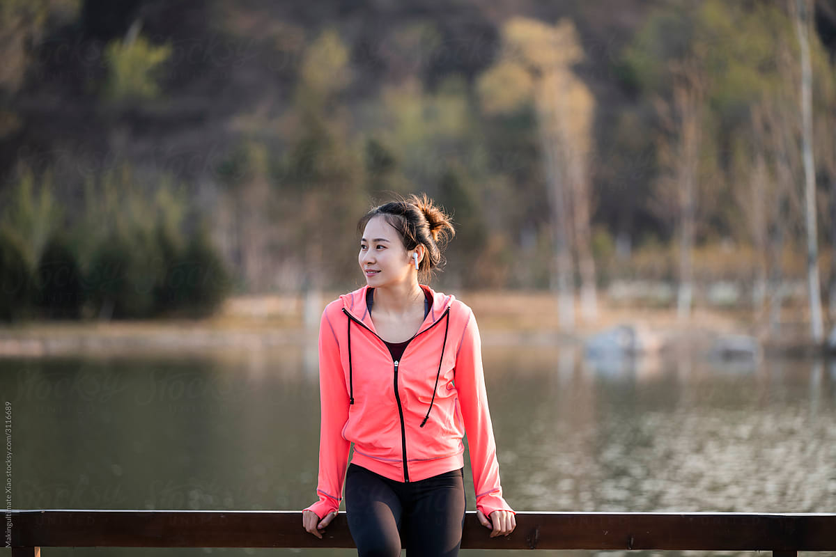 A beautiful Chinese woman doing fitness outdoors