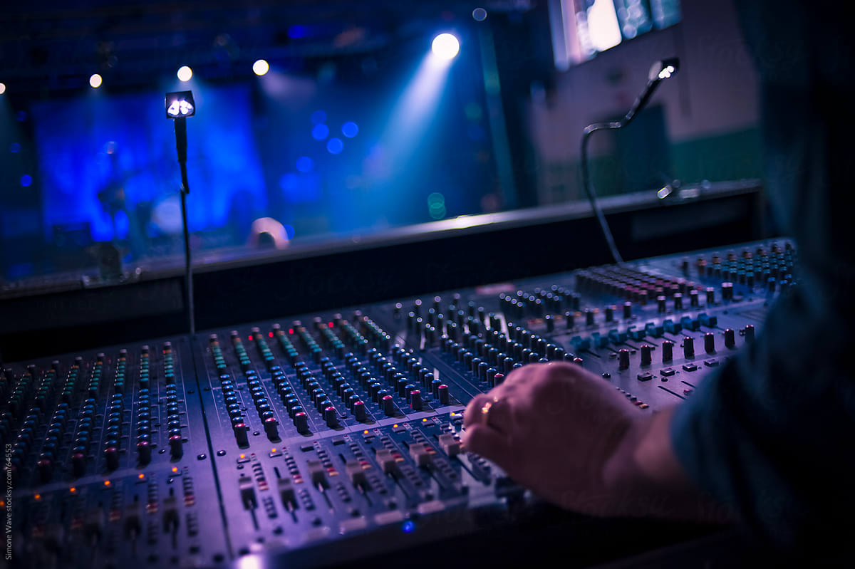 Hand on a sound mixer during a concert