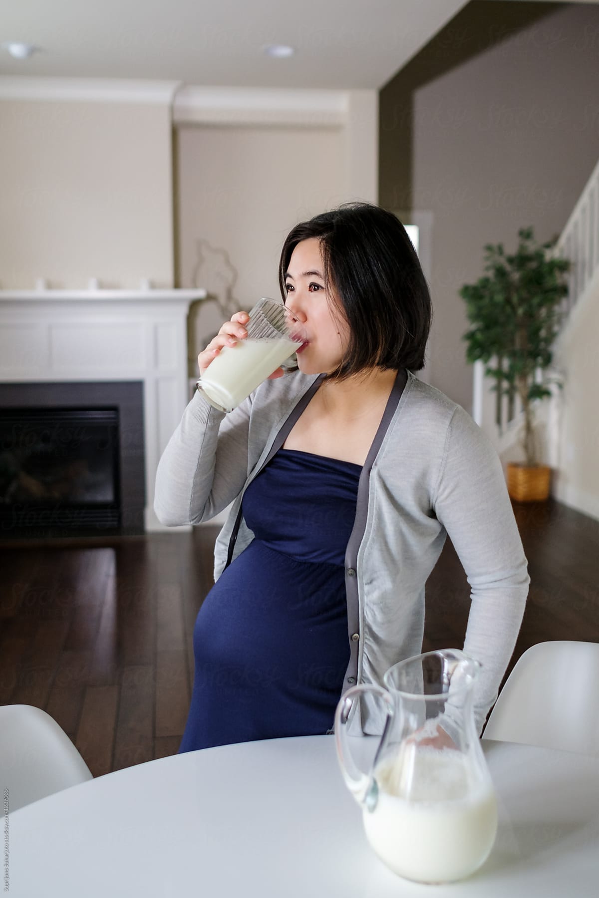 Pregnant Asian Woman Drinking Milk At Home By Take A Pix Media 4268