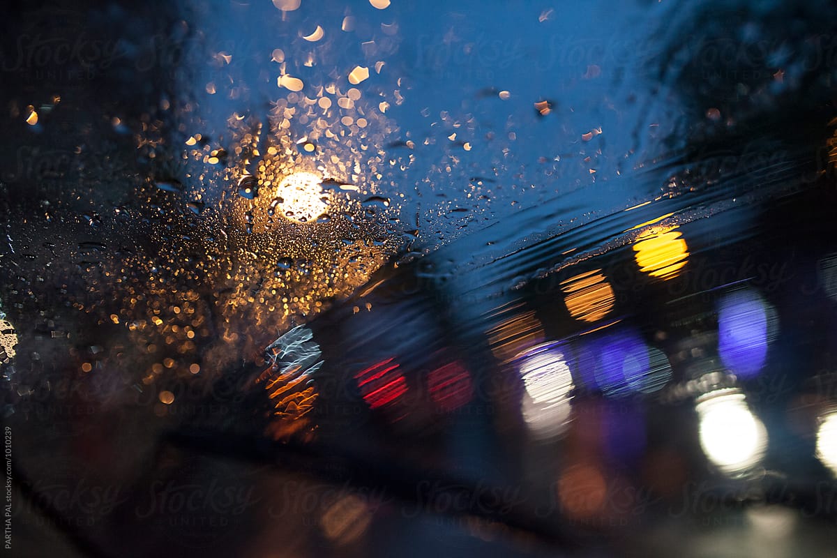 obscure street lights through wind screen in rain