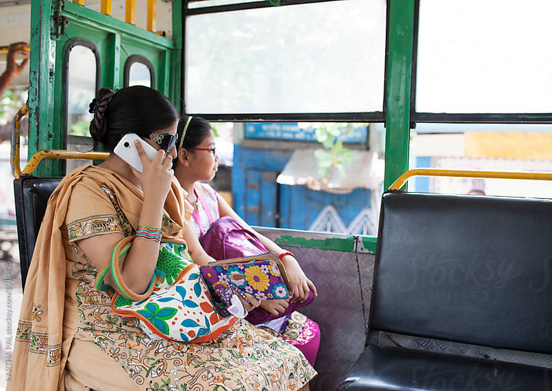 Mother and daughter travelling in a local Bus