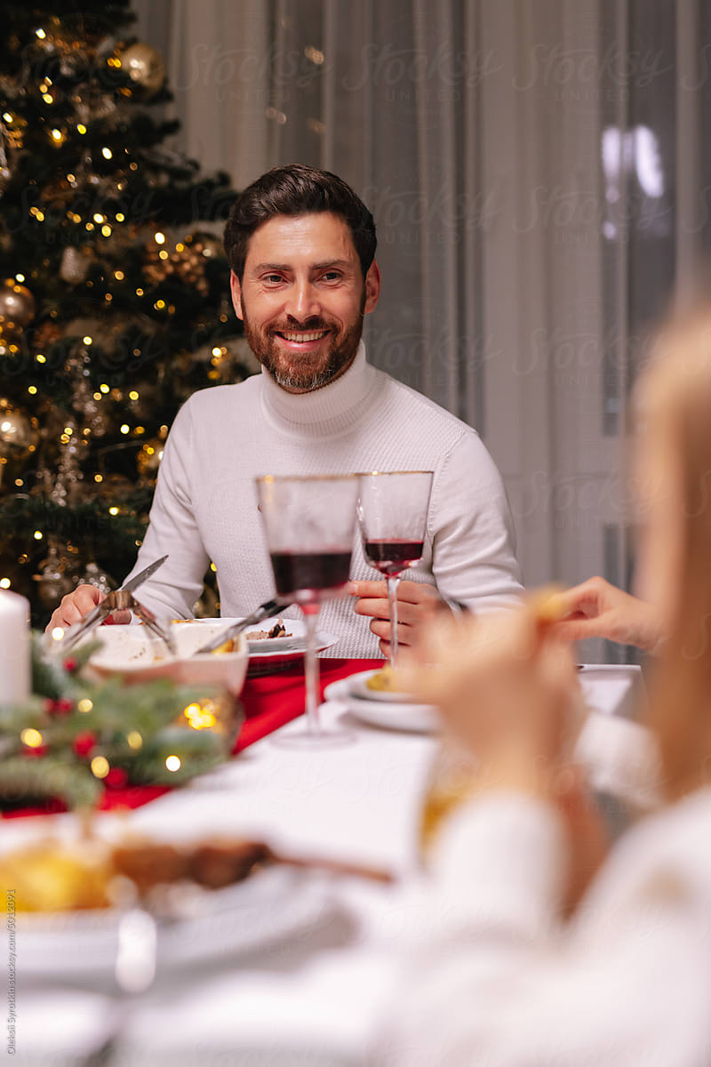 Together. Family time. Christmas eve. Cheerful smile. Festive dinner