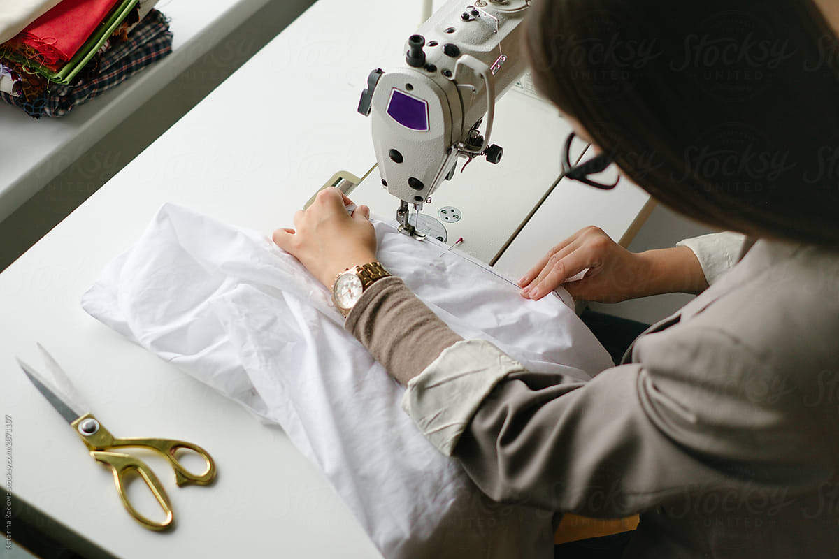 Woman Sewing Clothing Prototypes