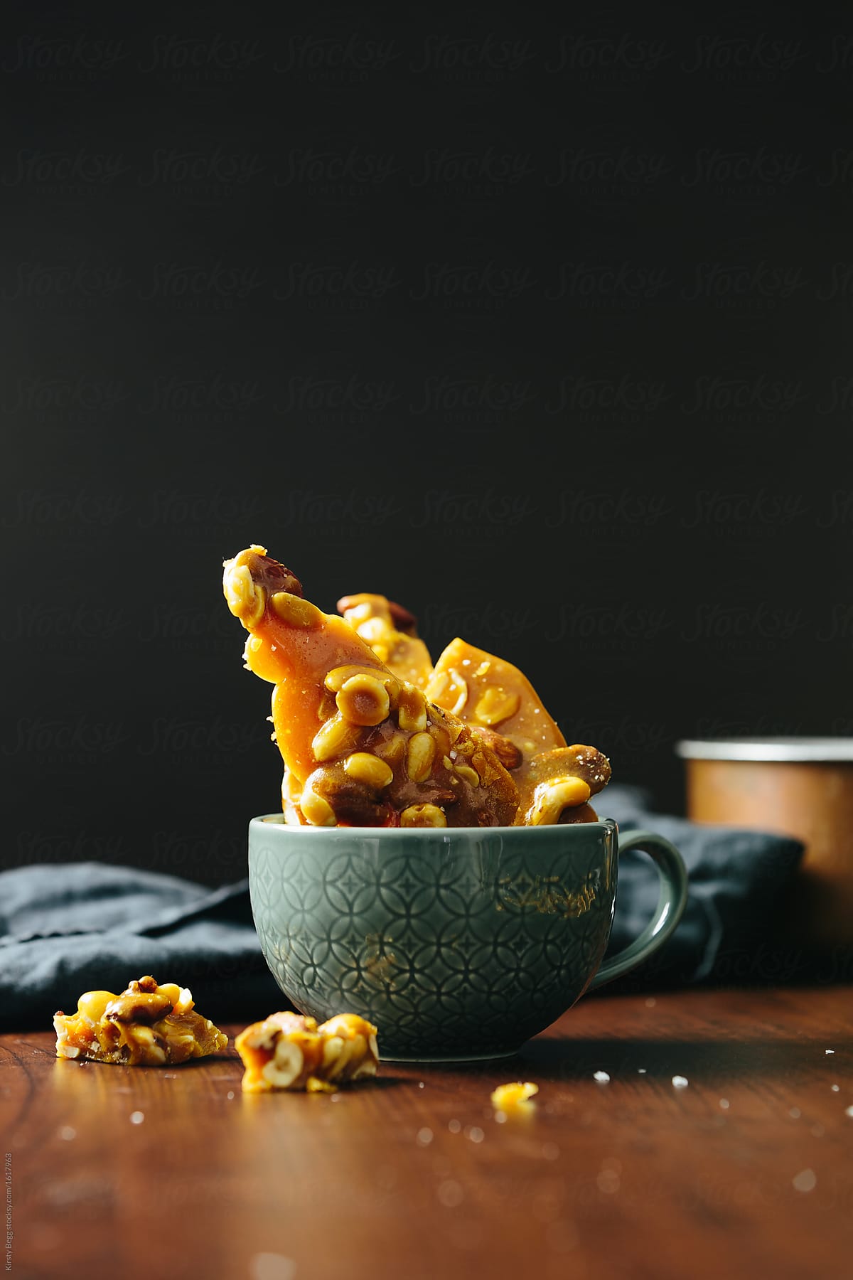 Vertical of nut brittle shards in cup