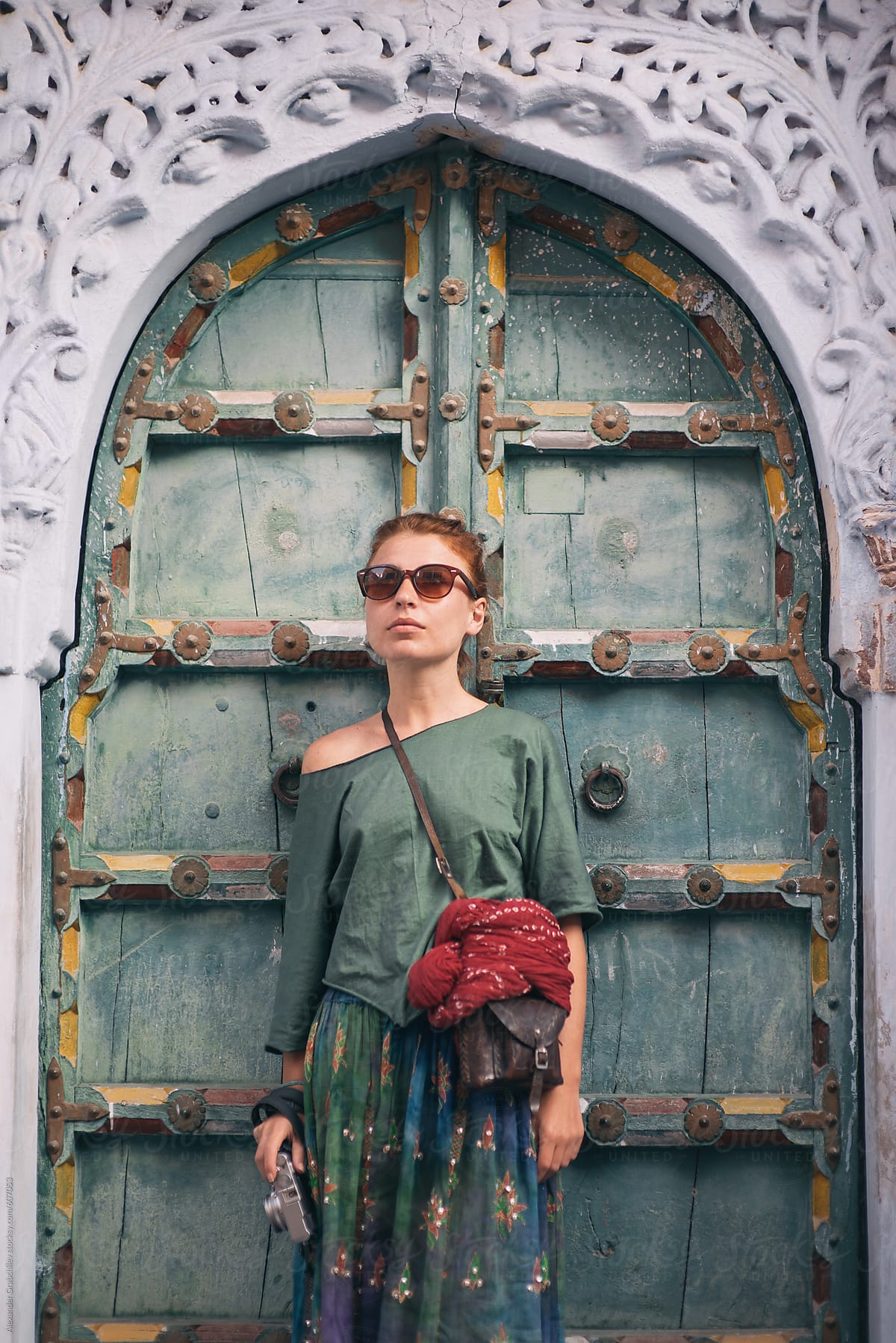 Tourist Woman Near Old Wooden Arched Door