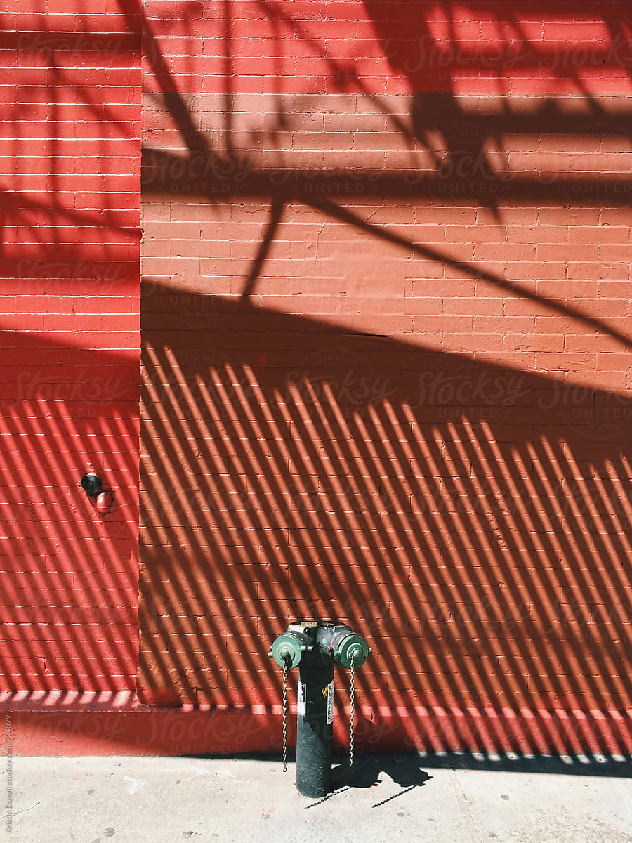 Shadows on red brick wall. Soho. New York City.