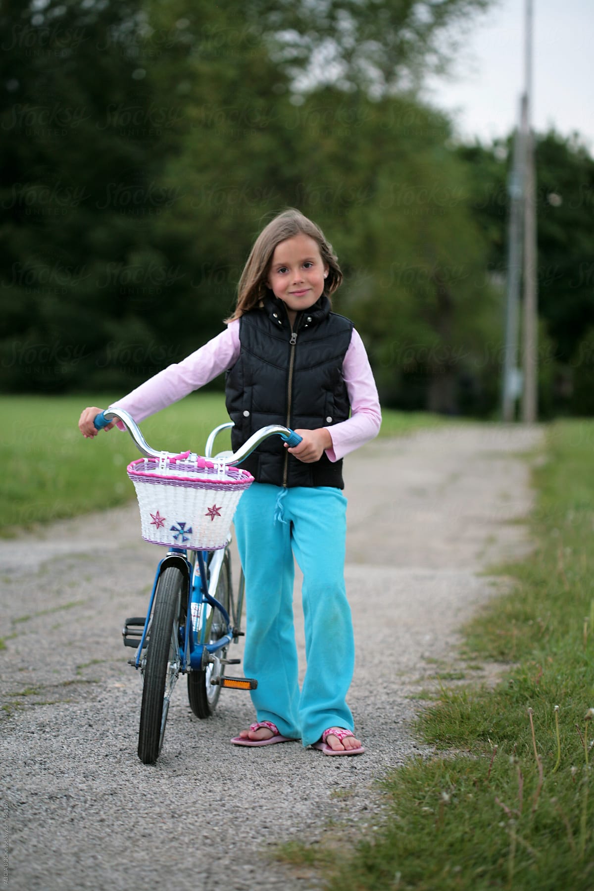 A Girl Standing With Her Vintage Bicycle Ready For A Bike Ride