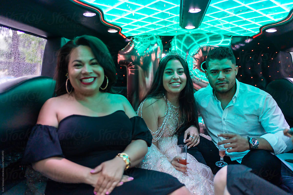 Portrait Quinceanera With Friends On Her Birthday In A Limousine.