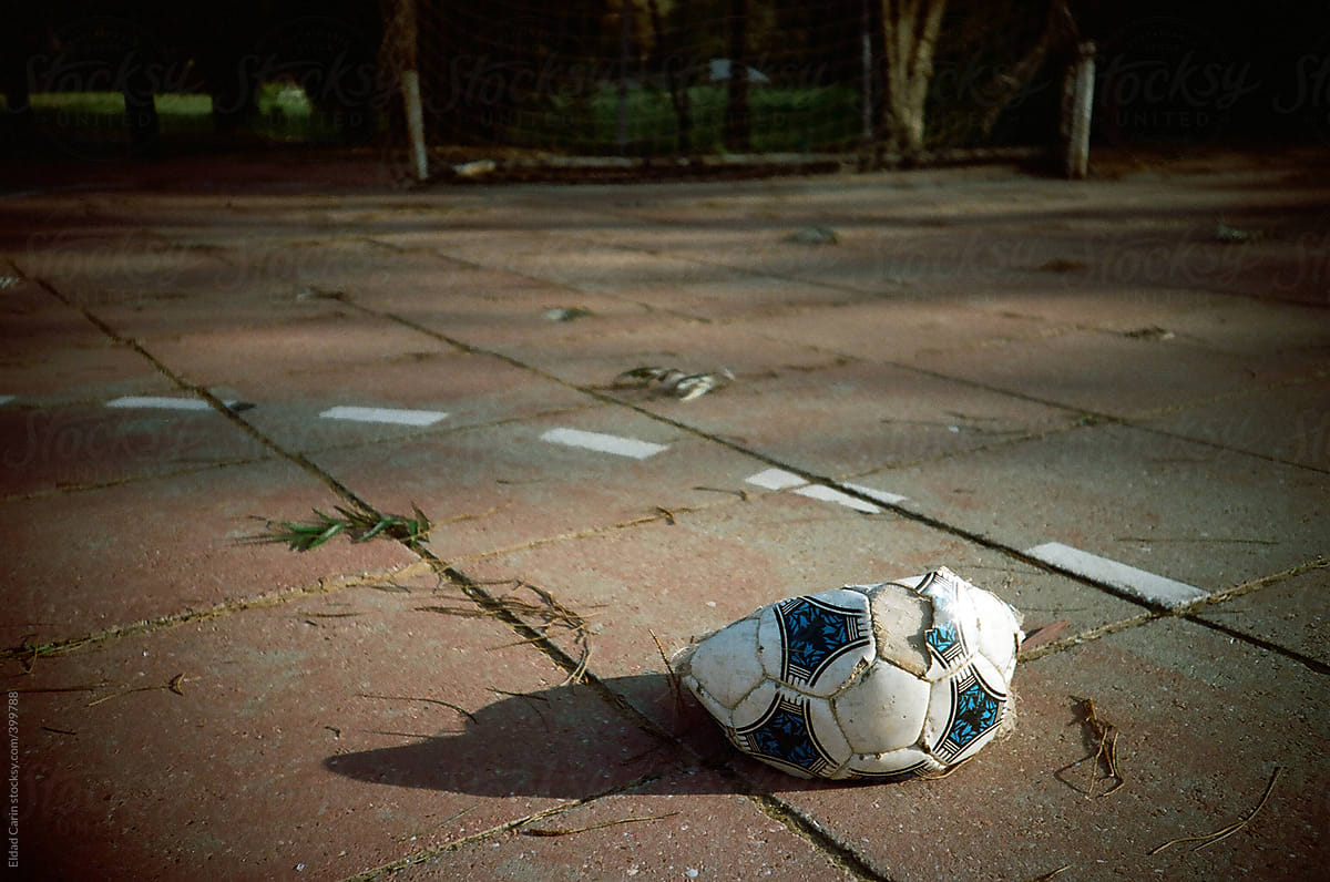 Deflated Soccer Ball in Court