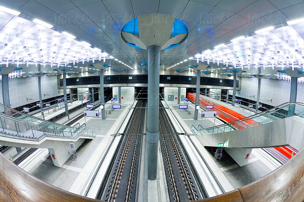 Europe, Germany, Berlin, train pulling into the new modern main railway station - futuristic interior design