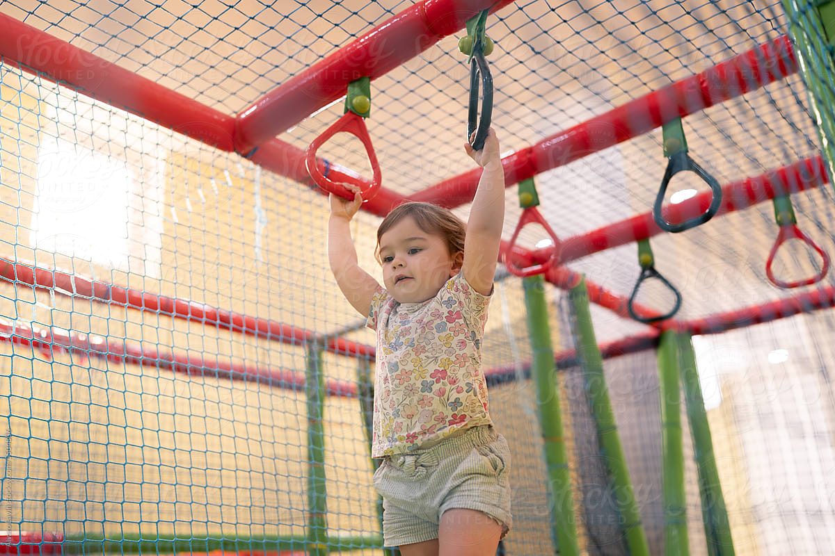 Child playing in indoor playground.
