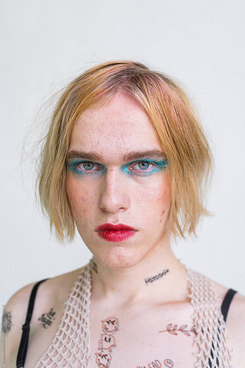 Portrait Of A Non-Binary Person With Makeup On and Acne Skin