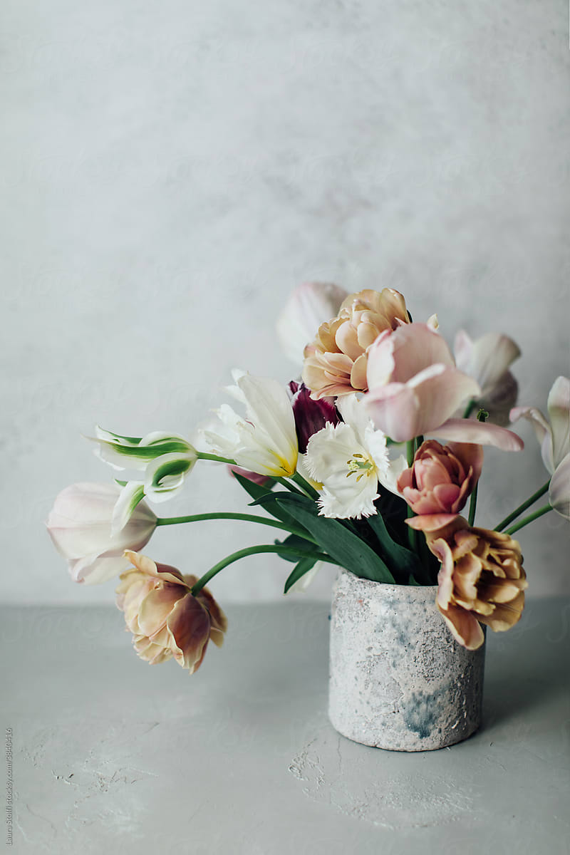 Pale colored decadent tulips composition