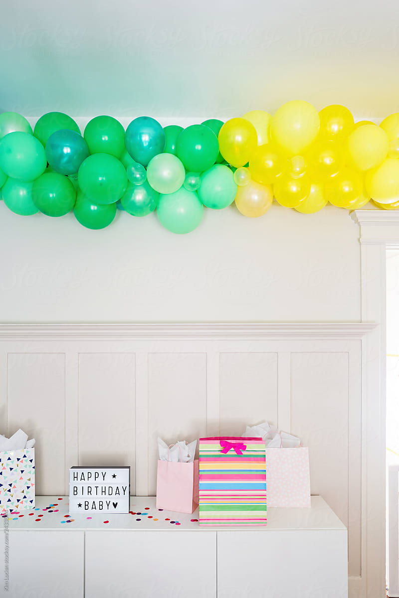 Balloon Arch over Gifts and Happy Birthday Sign