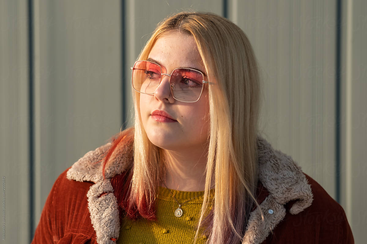 Cute Teenage Girl Wearing Sunglasses by Stocksy Contributor