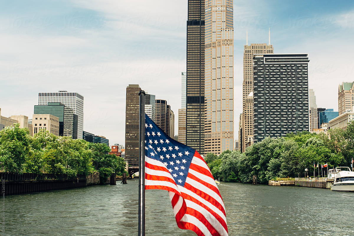 American flag on Chicago river and skyline