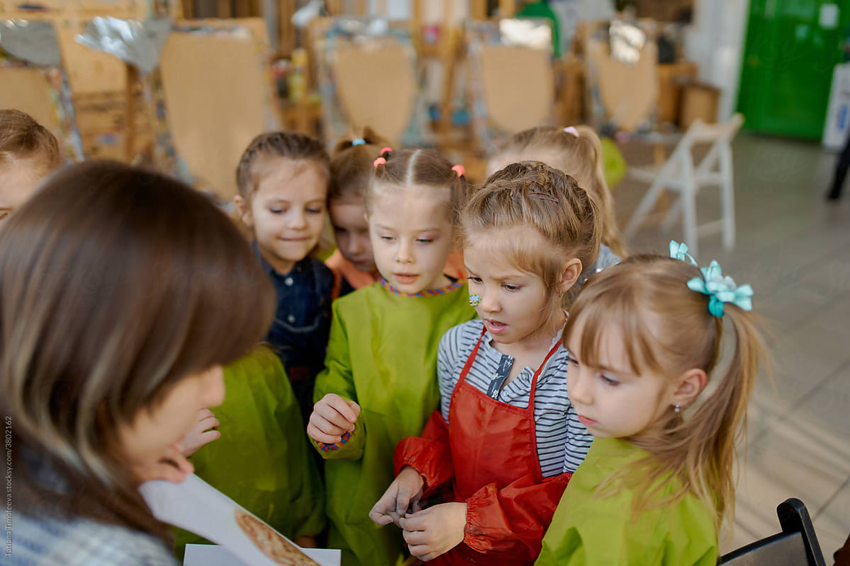 teacher and her young pupils during the art class