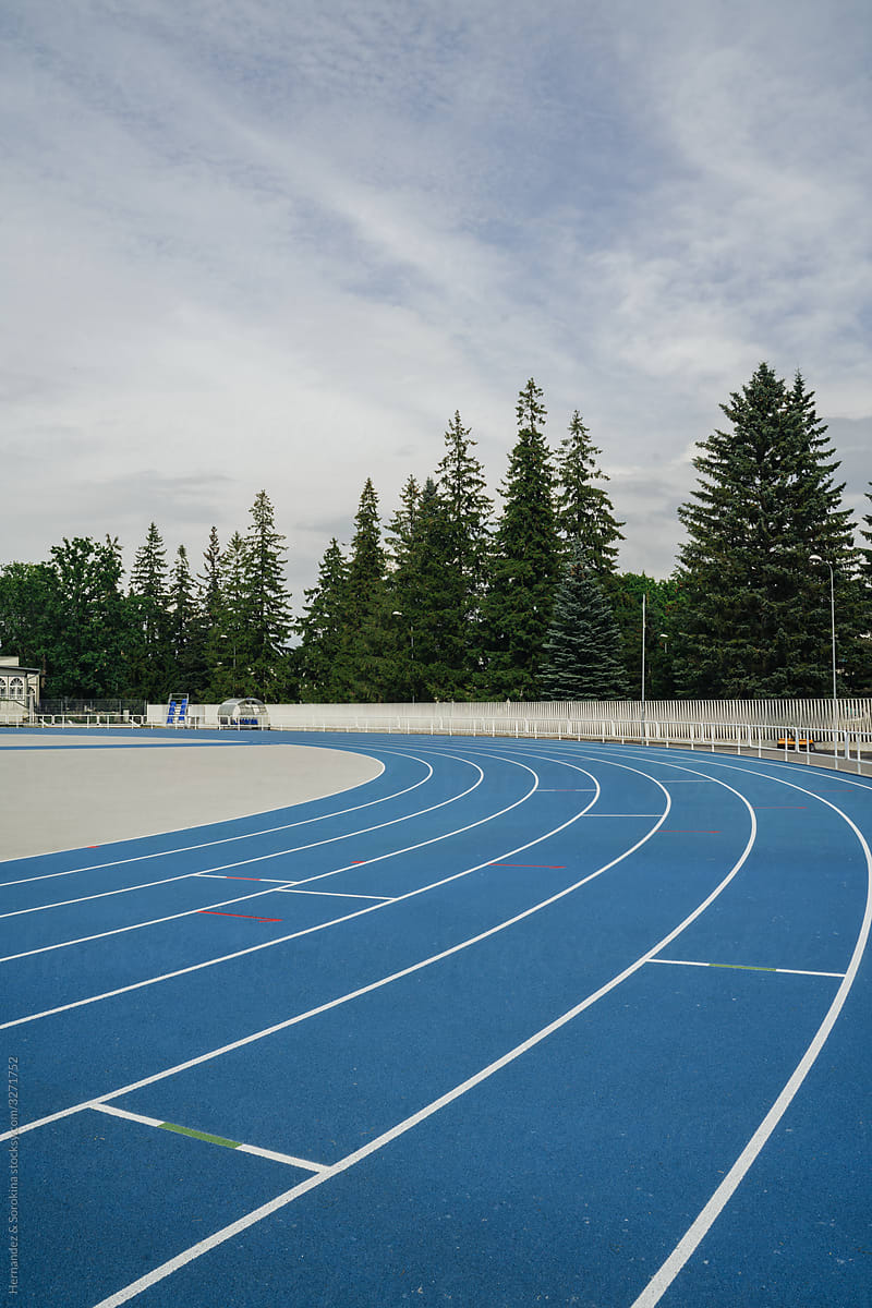 Blue Running Lanes At Modern Outdoor Stadium