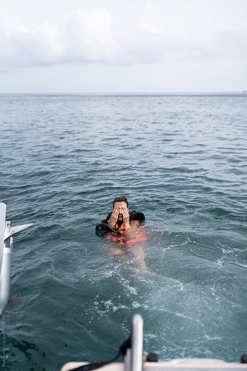 Person Floating in Water With Life Jacket On