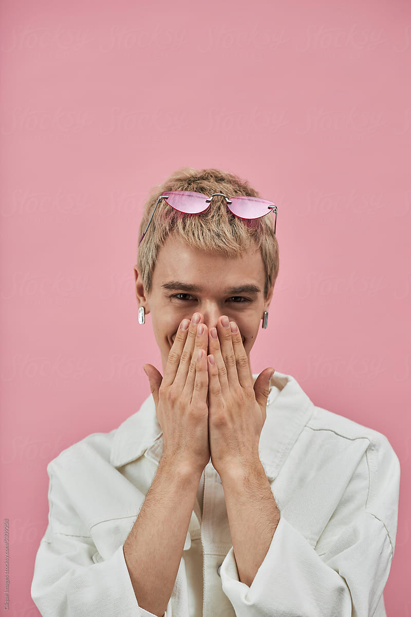 Queer Model Covering His Smile With Hands
