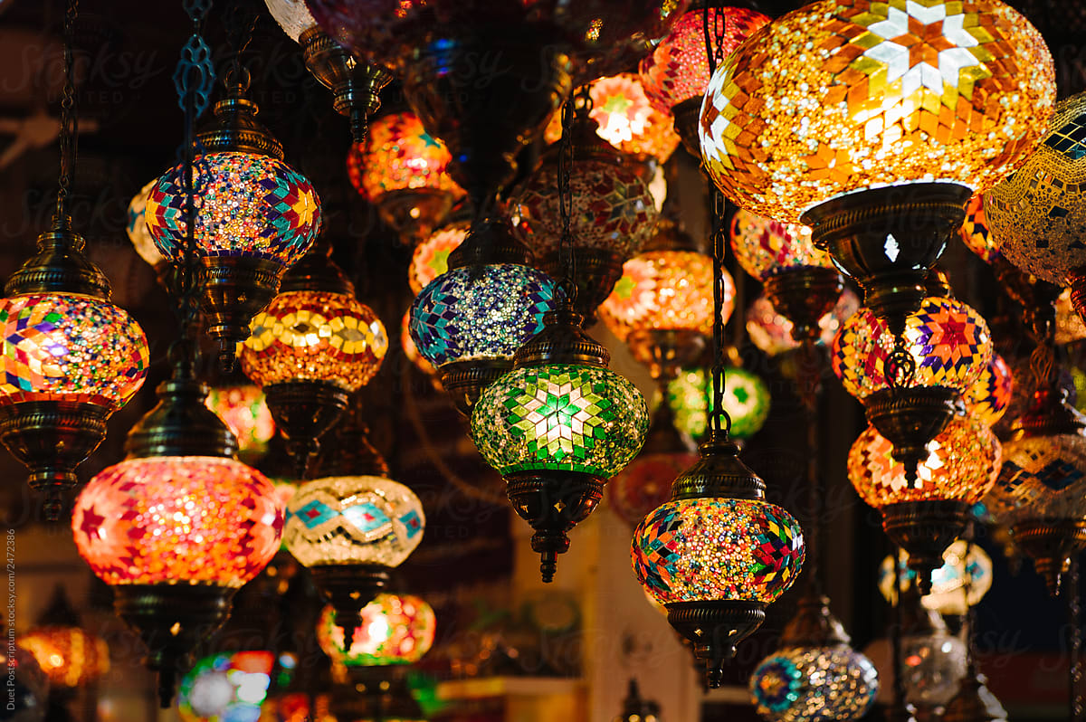 Vintage beautiful illuminated lanterns hanging in small shop