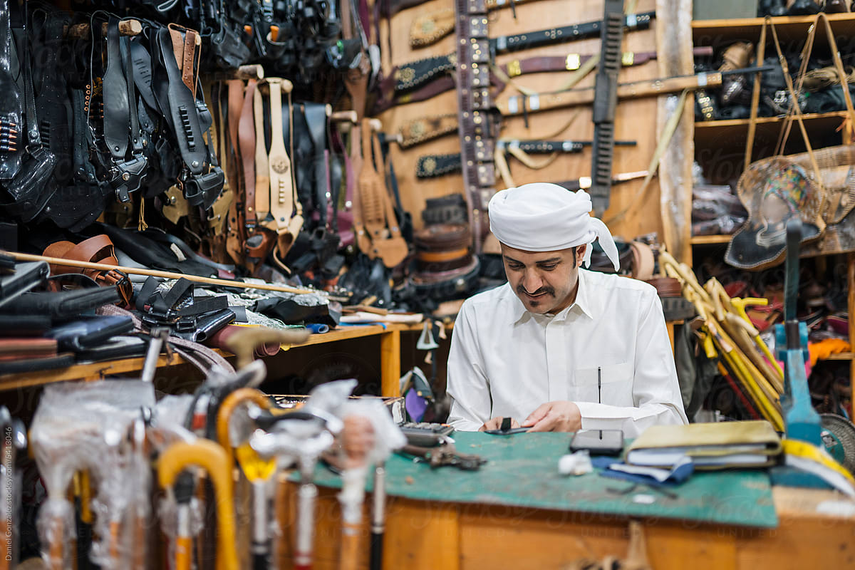 Middle Eastern man working in leather workshop