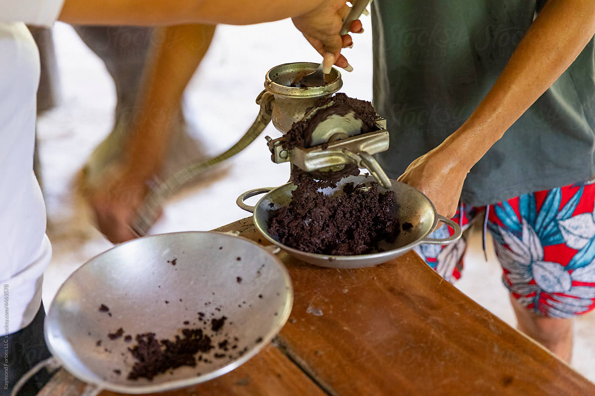 Grinding Cocoa paste from cacao Seeds for making chocolate