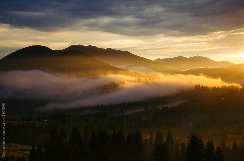 Mountain fog at sunset fairy tale landscape
