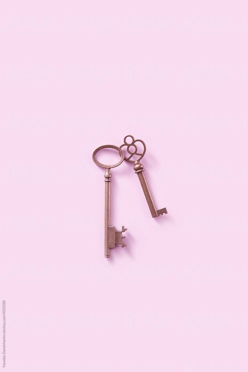 Retro ornate keys tightly connected on violet background
