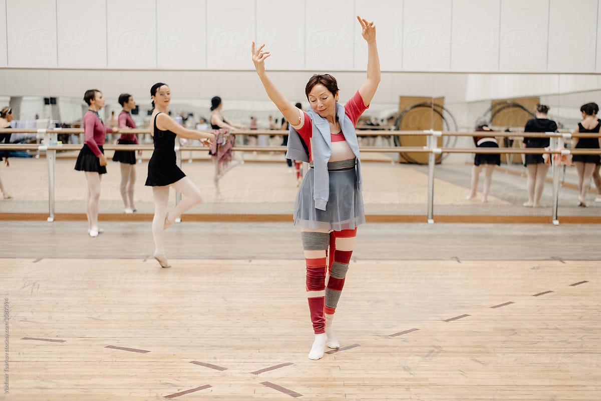 middle aged woman dancing in ballet school