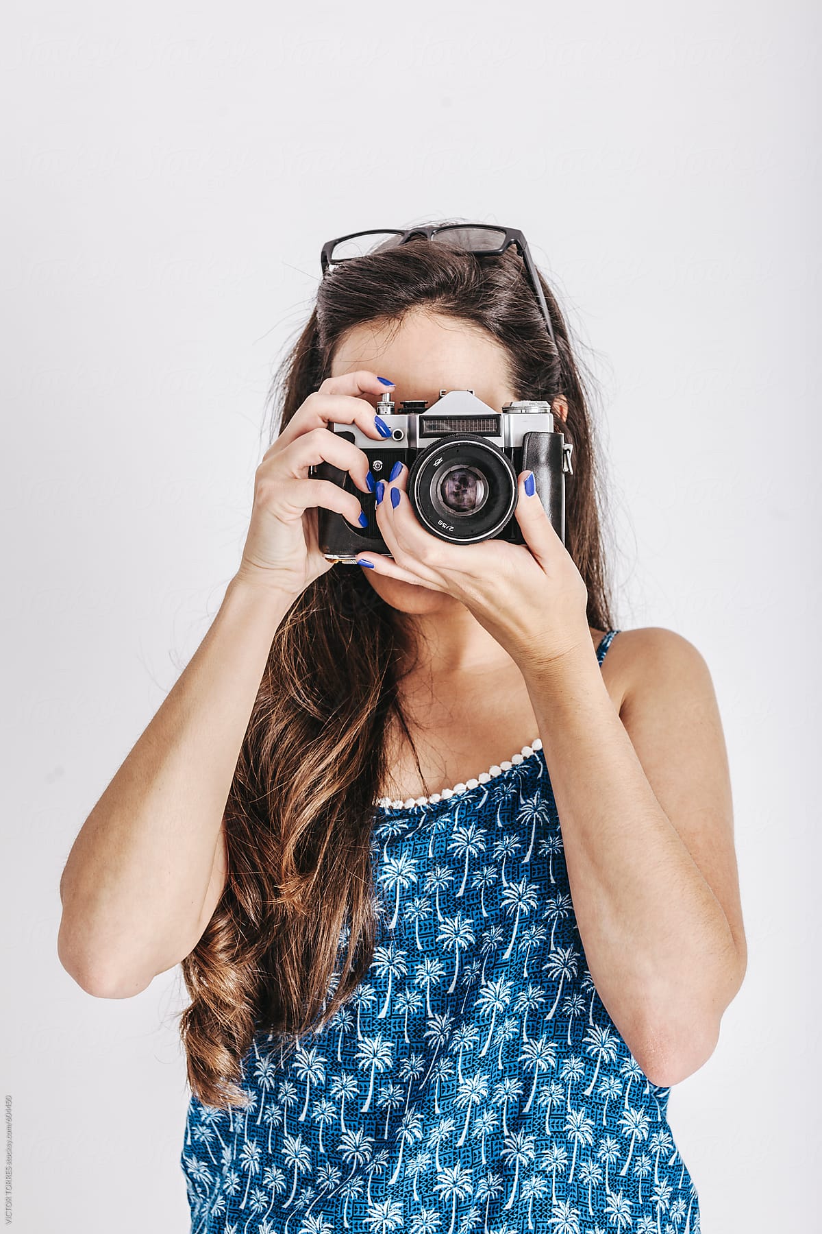 Young Woman Holding a Retro Camera