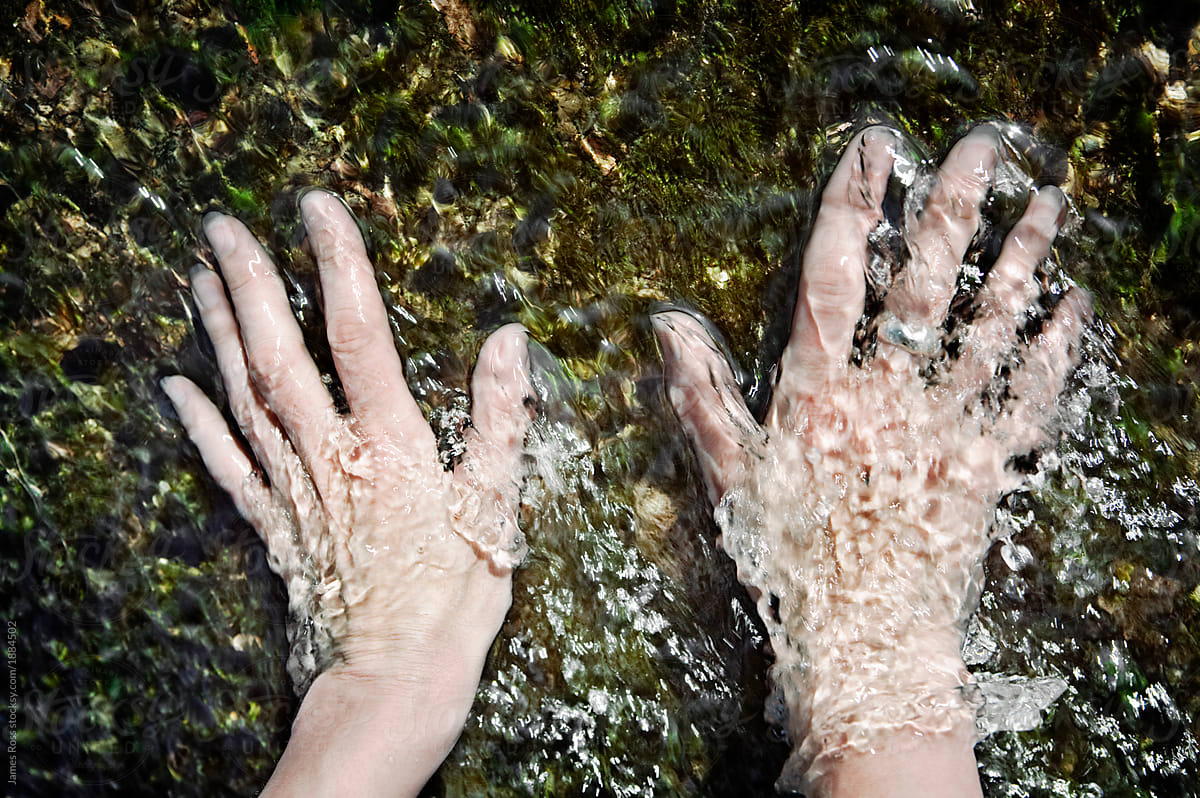 Hands in a stream