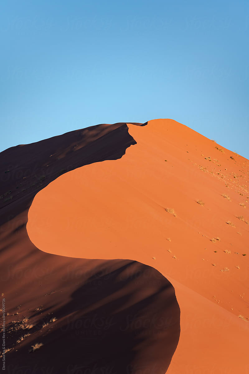 Detail of a sand dune in Namib desert, with blue and clean sky, Africa