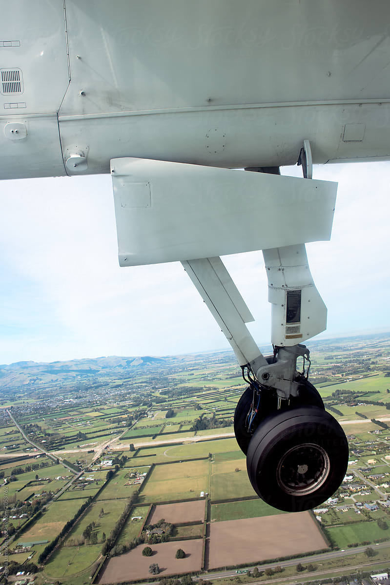 Landing gear and the Canterbury plains on approach to Christchurch airport