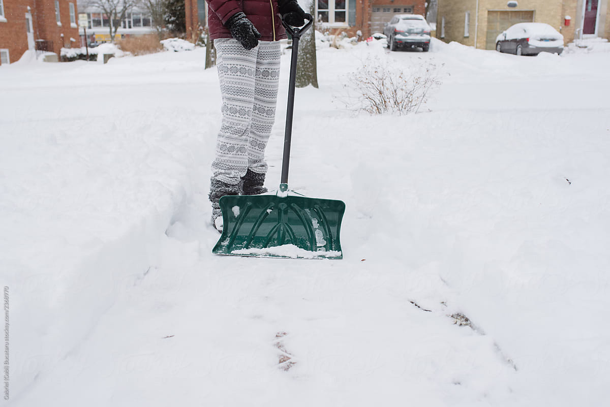 Woman Shoveling Snow