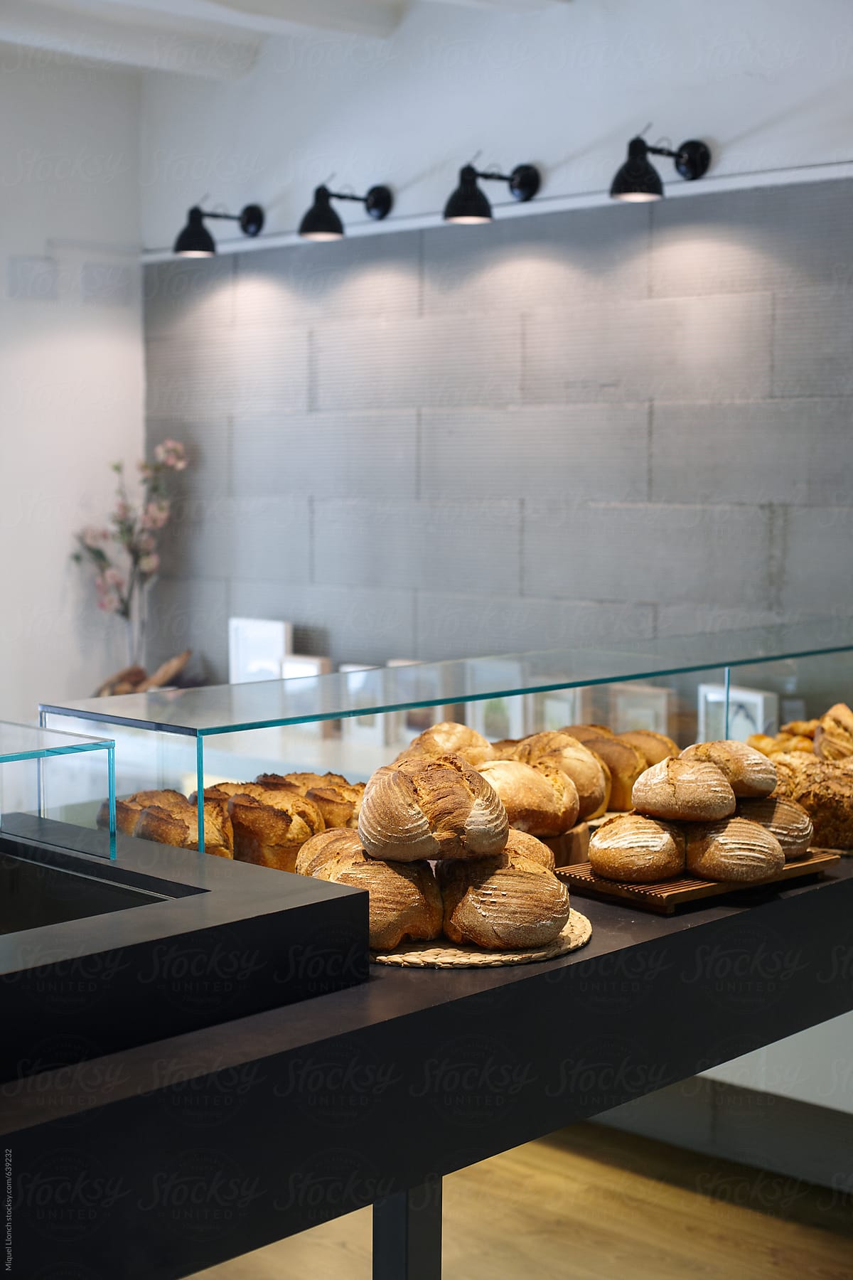 Modern bakery counter with artisanal bread loaves