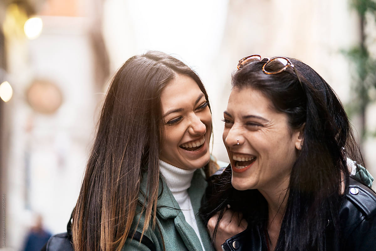 Lesbian Couple Laughing Together By Stocksy Contributor Santi Nuñez Stocksy