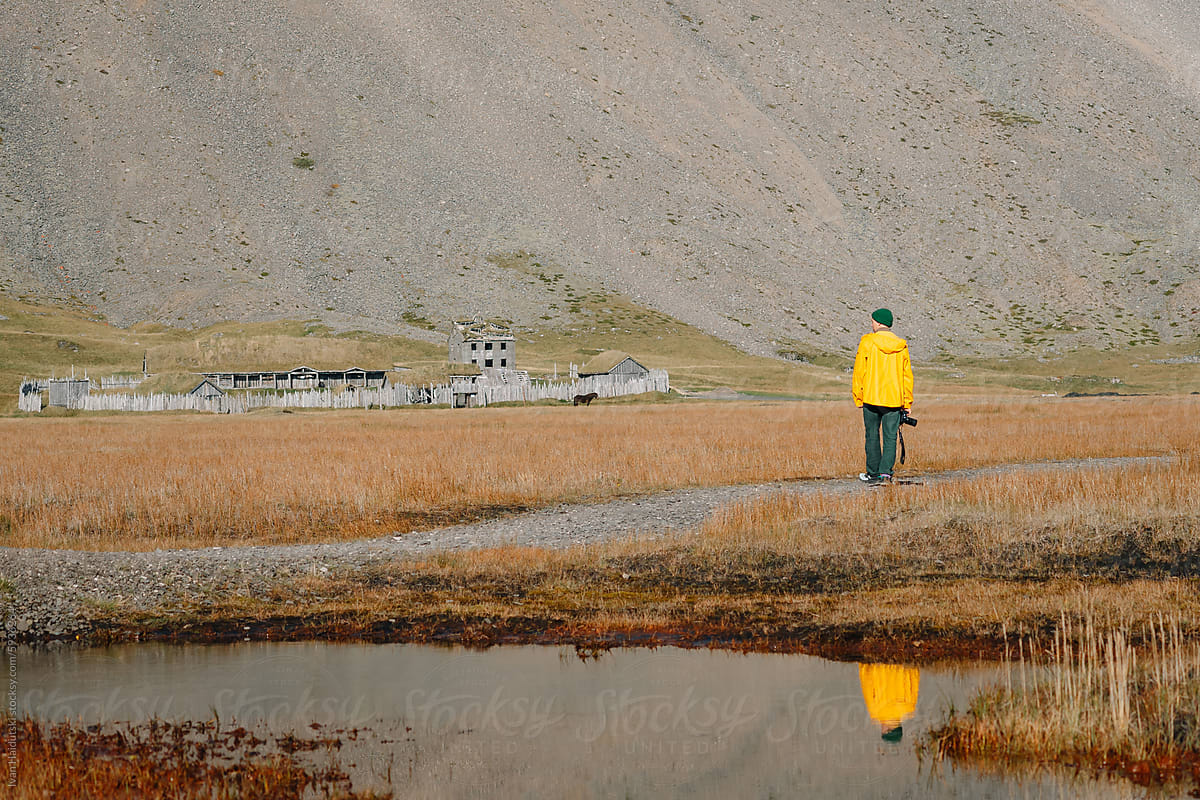 Unrecognizable Man exploring Viking Village Prop for movie, Iceland.