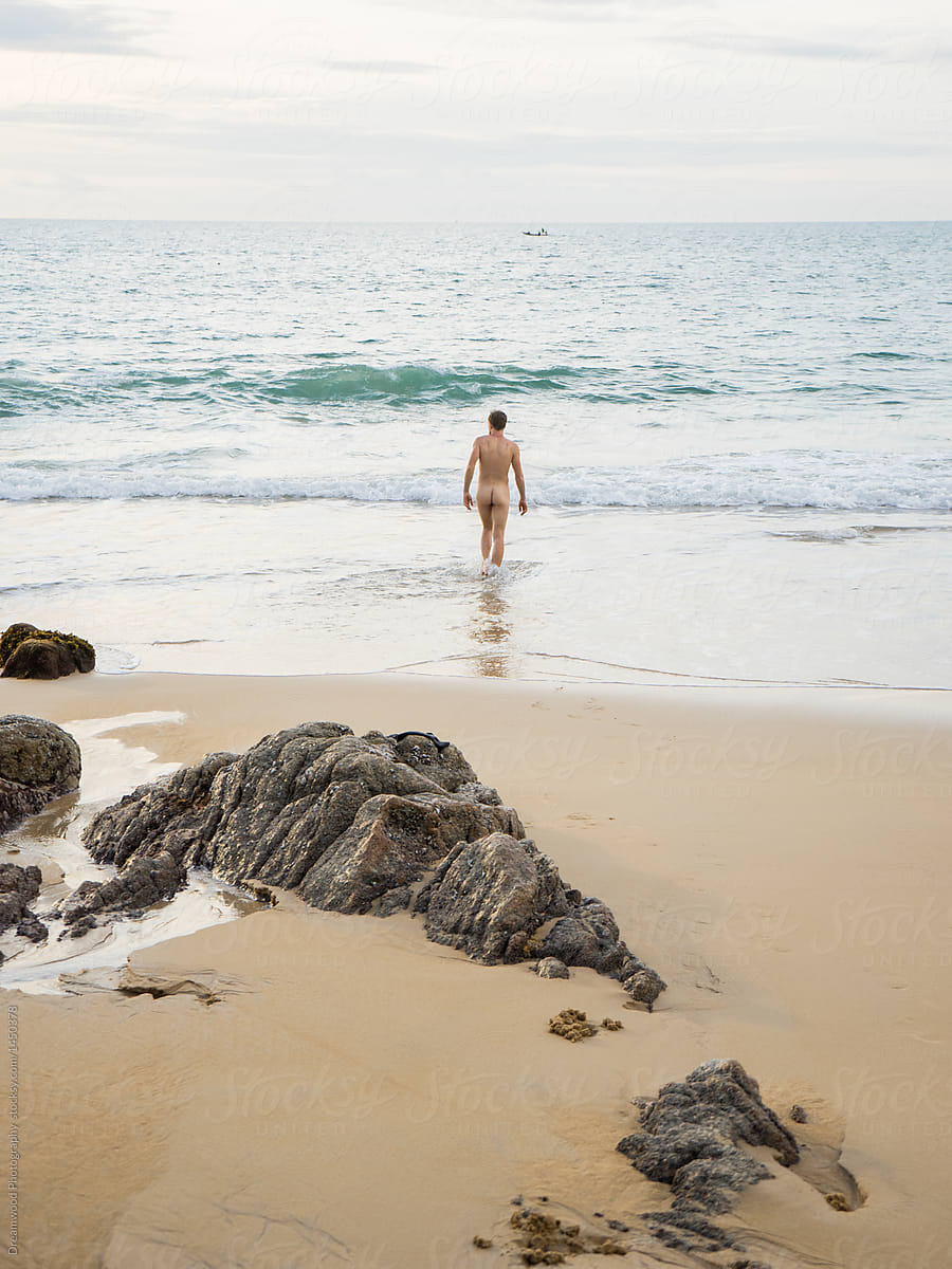 Naked man on beach