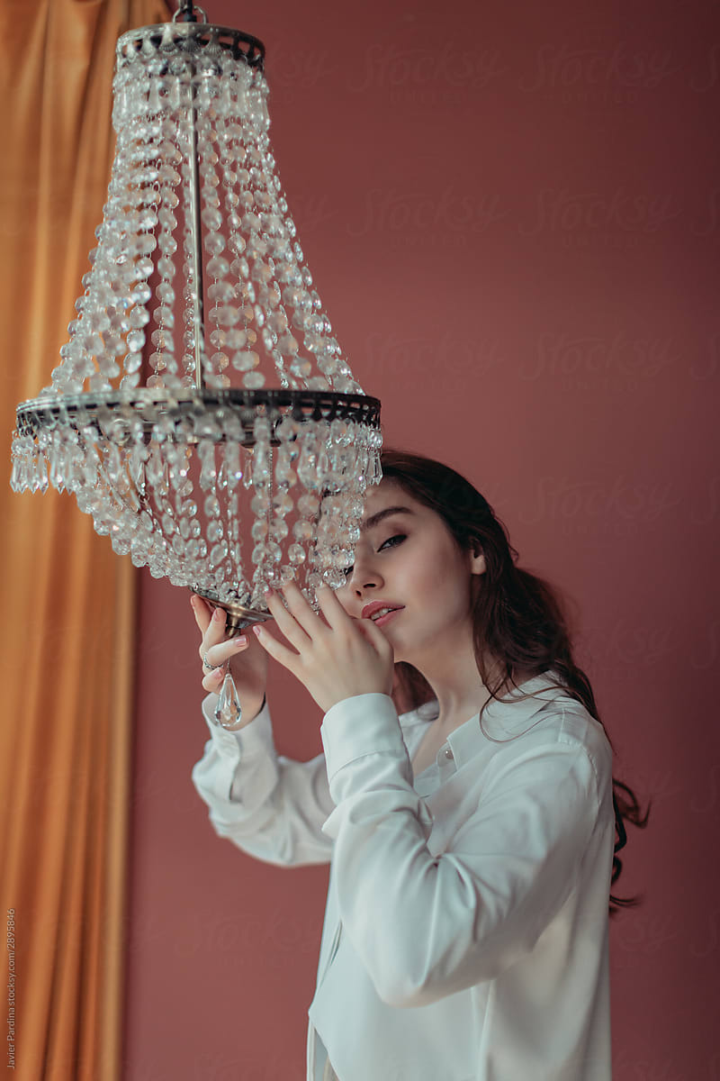 Portraits of a young girl in love with a lamp
