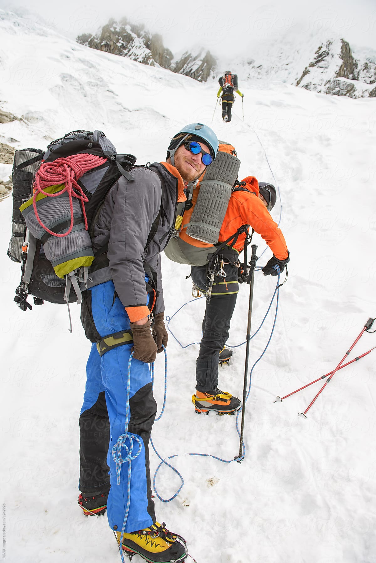 Mountaineering team preparing to travel up a Glacier in Cordillera Blanca