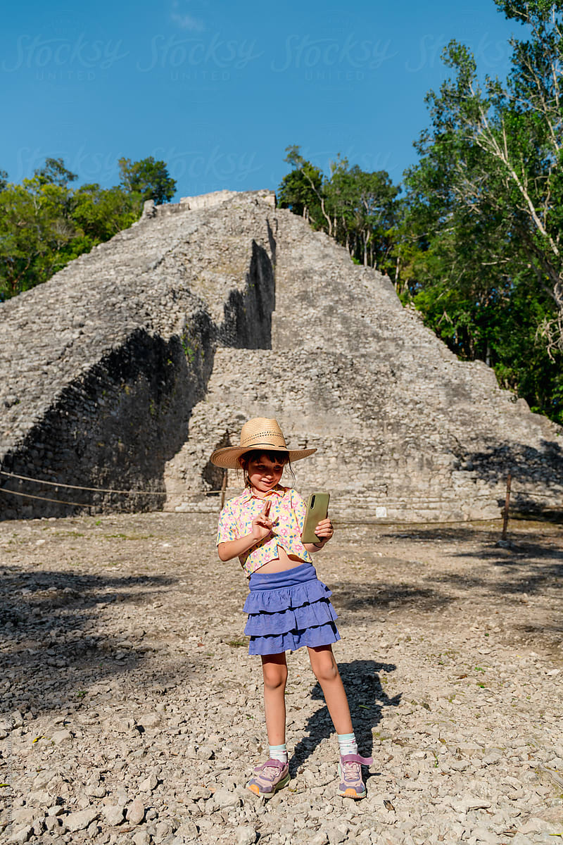 Girl taking travel selfies in Cobá, Mexico