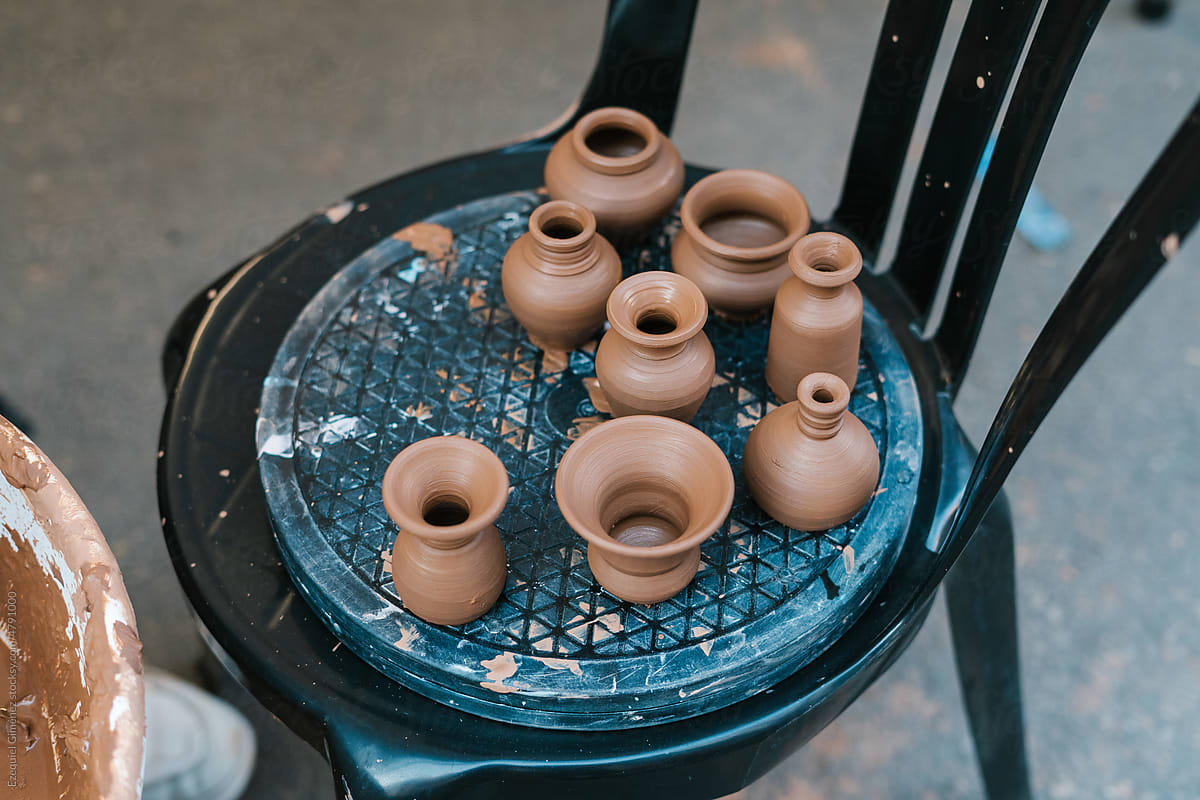 Various pottery placed on chair